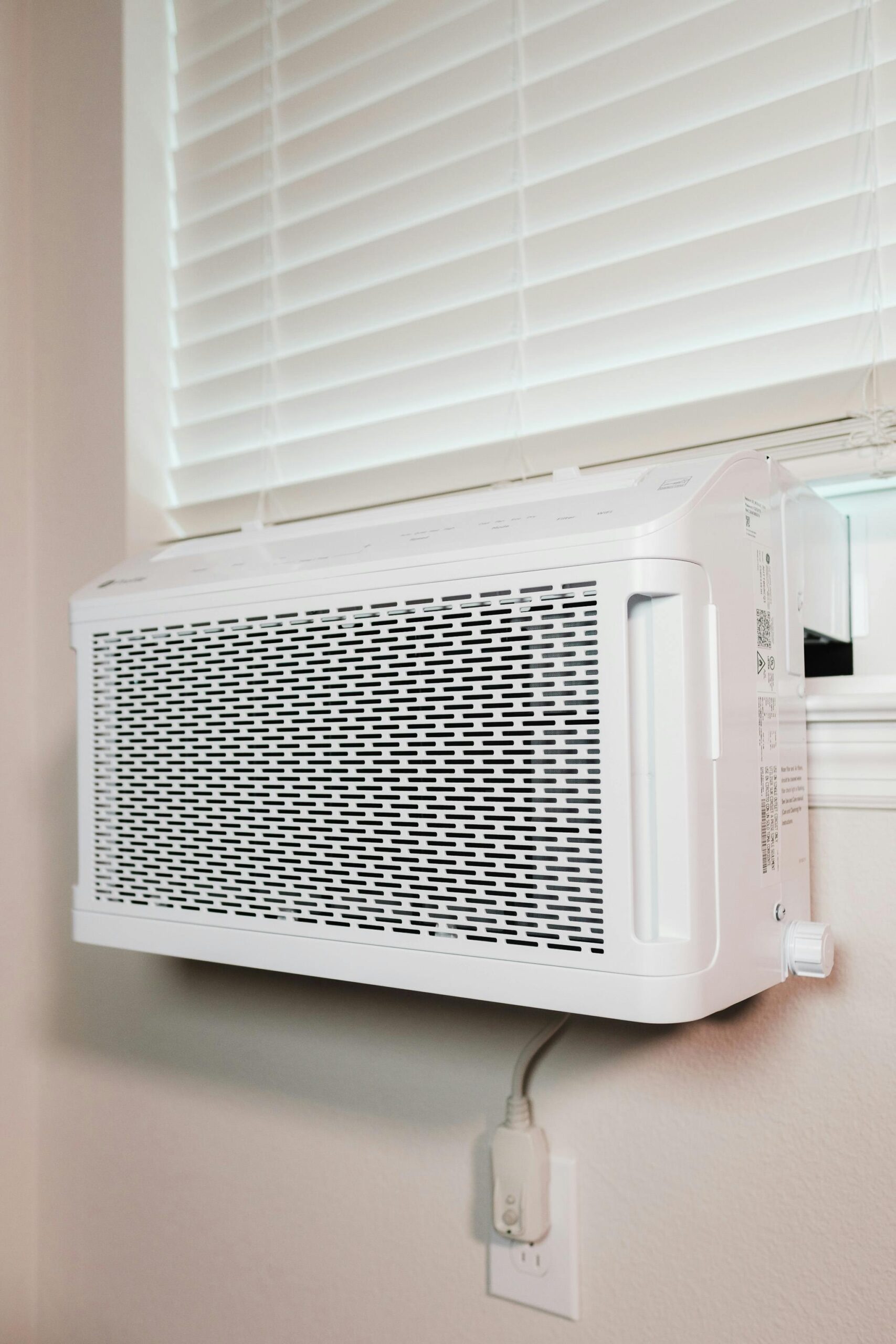 Wall-mounted air conditioner installed in a residential setting, providing cooling comfort.